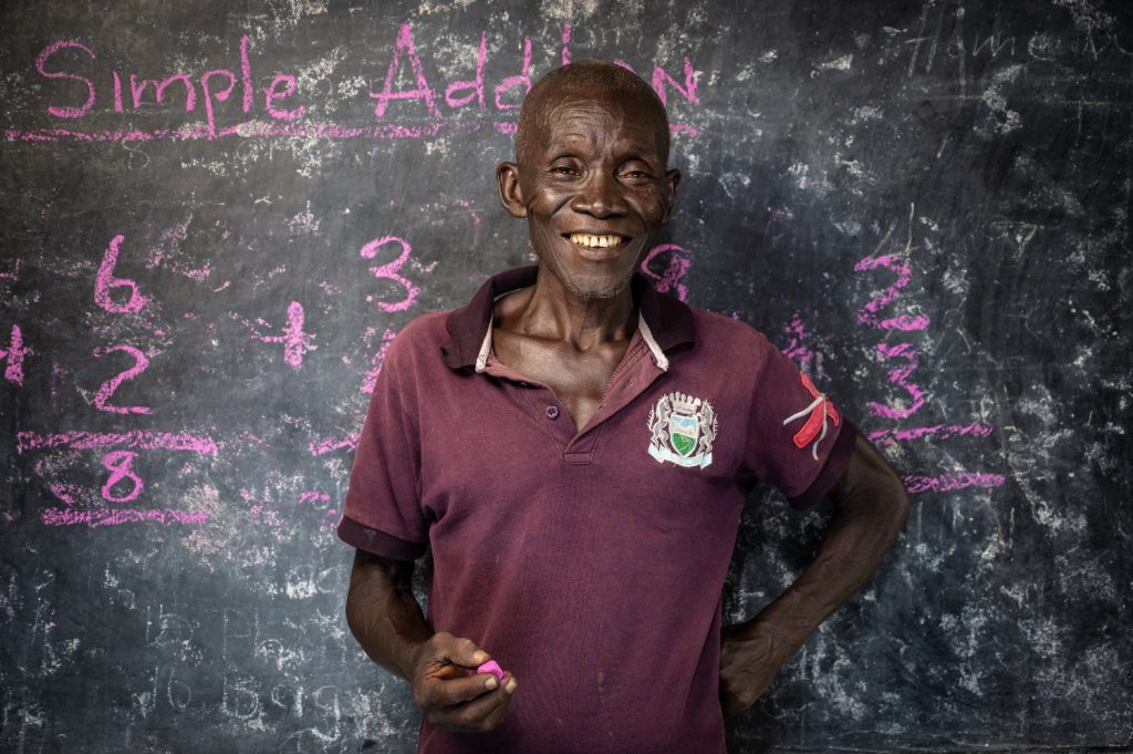 Teacher in front of a blackboard