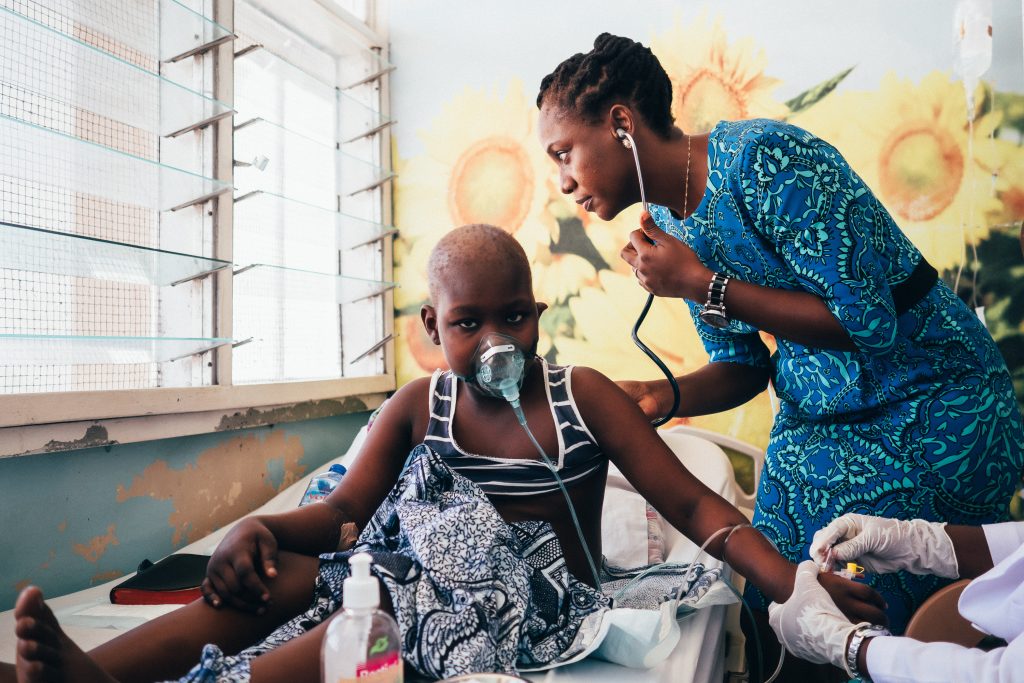 A patient is examined. Photo credit: Christian Back/World Child Cancer