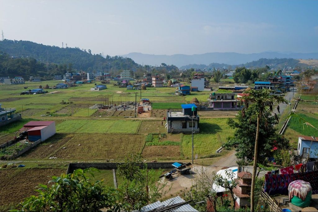 Greenery, houses and mountains